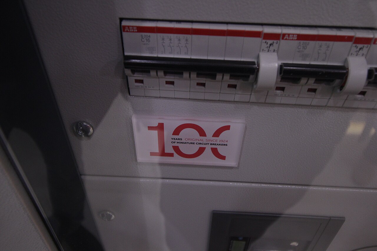 ABB miniature circuit breakers displayed above a centenary sign at InnoTrans 2024.