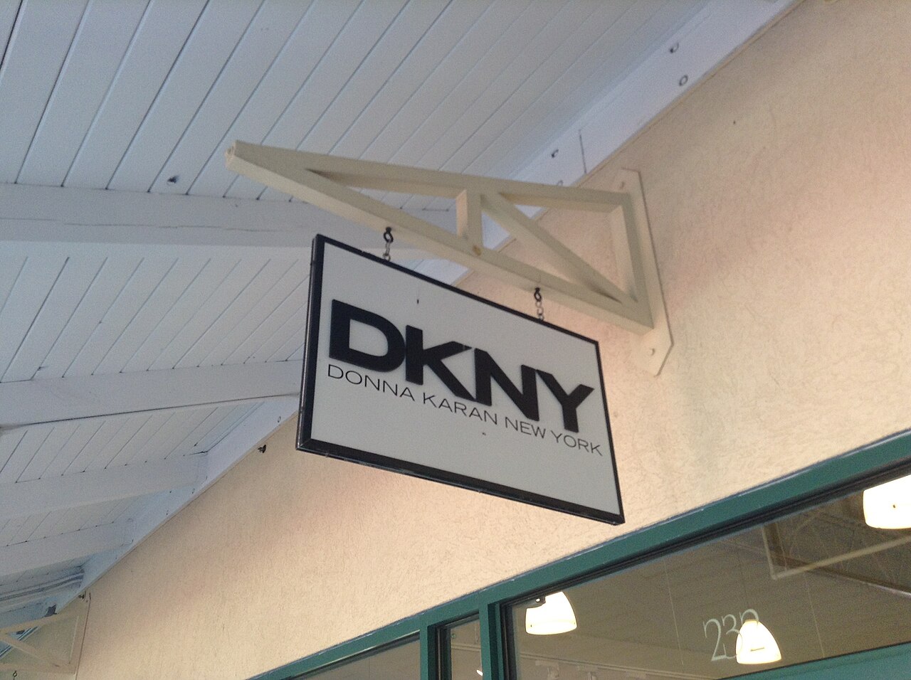 DKNY outlet store sign in Clinton, Connecticut, photographed in August 2014; not the planned Renfro legwear collection.