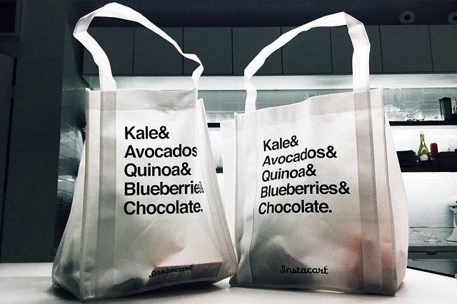 Instacart grocery delivery bags on a kitchen countertop in 2015