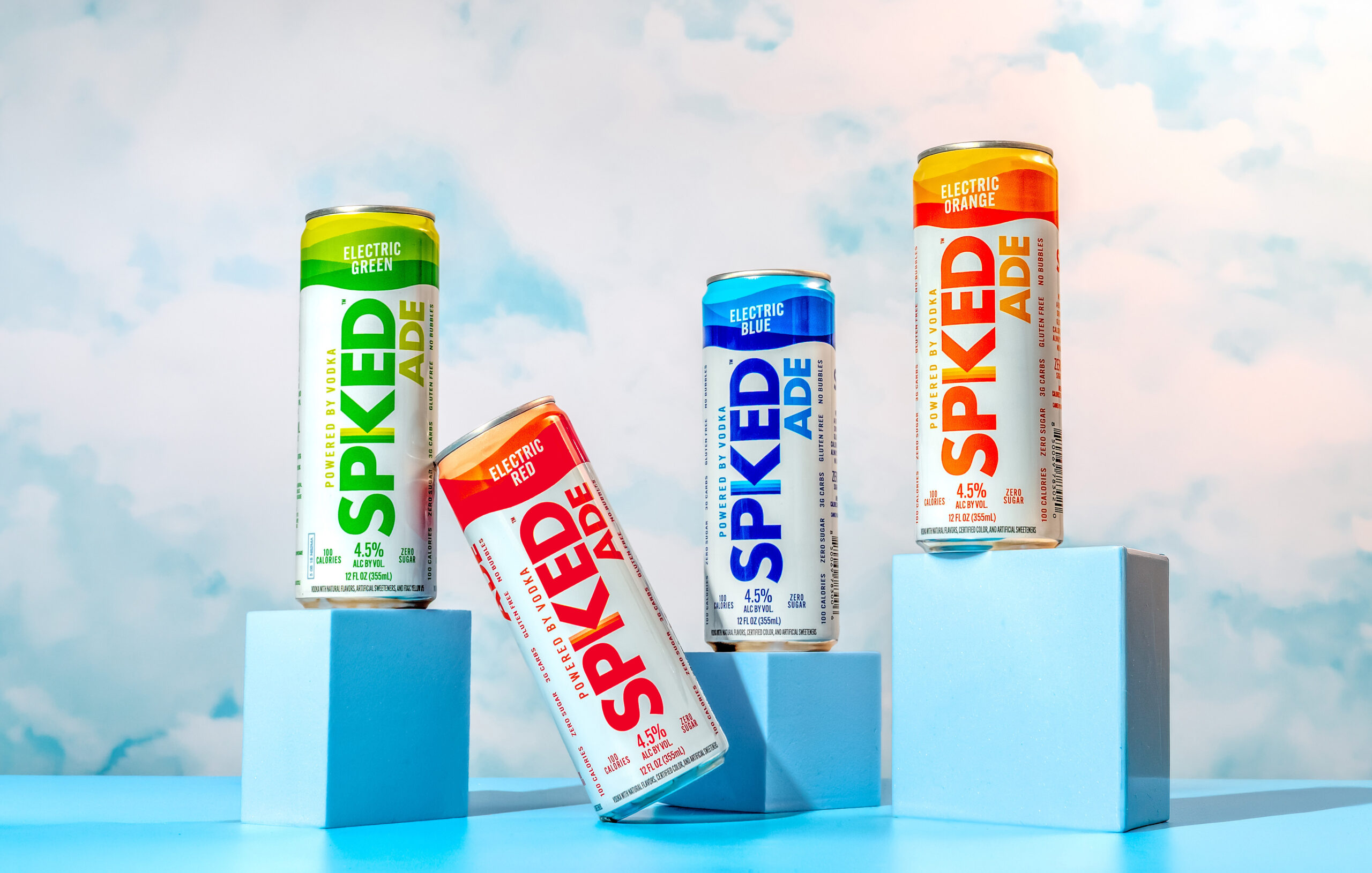 Four SpikedAde vodka-based ready-to-drink cans in Electric Orange, Electric Blue, Electric Green and Electric Red, from Constellation Brands’ acquisition announcement.