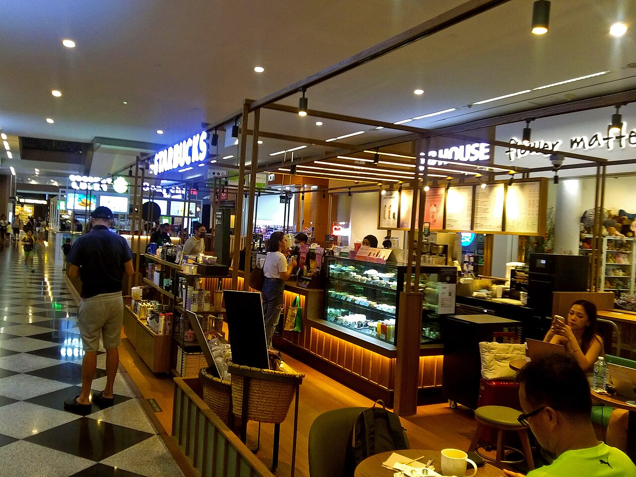 Interior of the Starbucks store at Millenia Walk in Singapore; an existing location within the licensed business covered by the proposed DFI transaction.