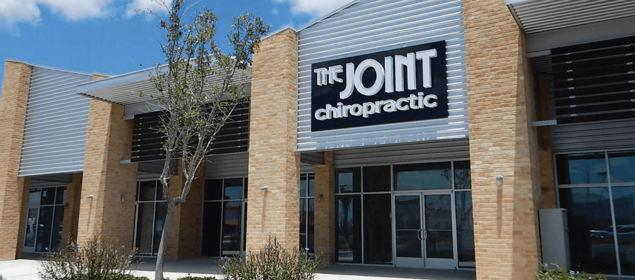 Exterior of an existing The Joint Chiropractic clinic, shown as a network example and not a clinic in the reacquired Texas territories.